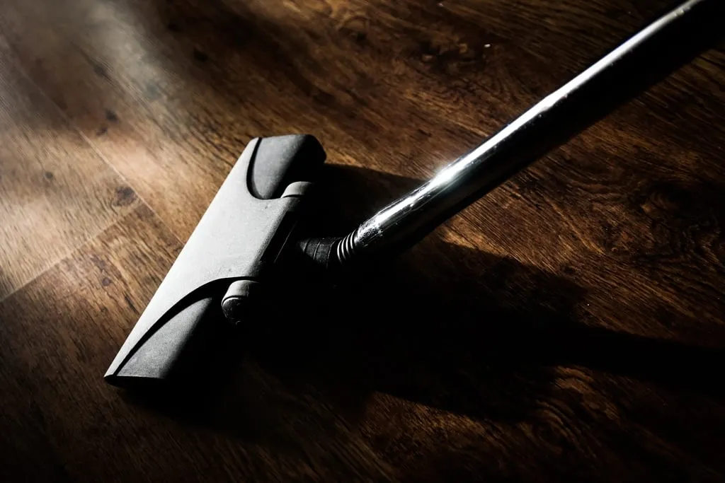 Vacuuming a hardwood floor